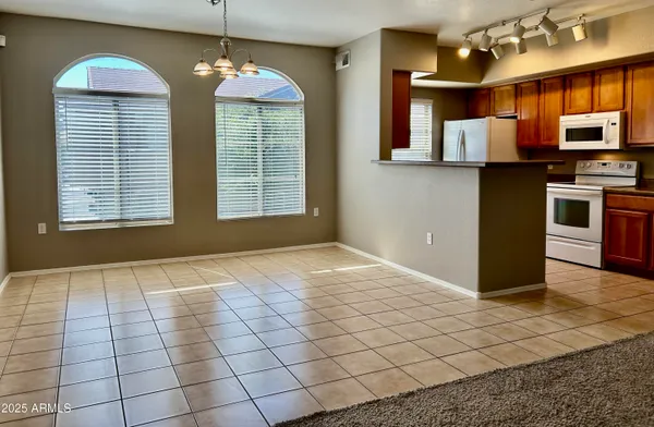 a view of a kitchen with microwave and cabinets