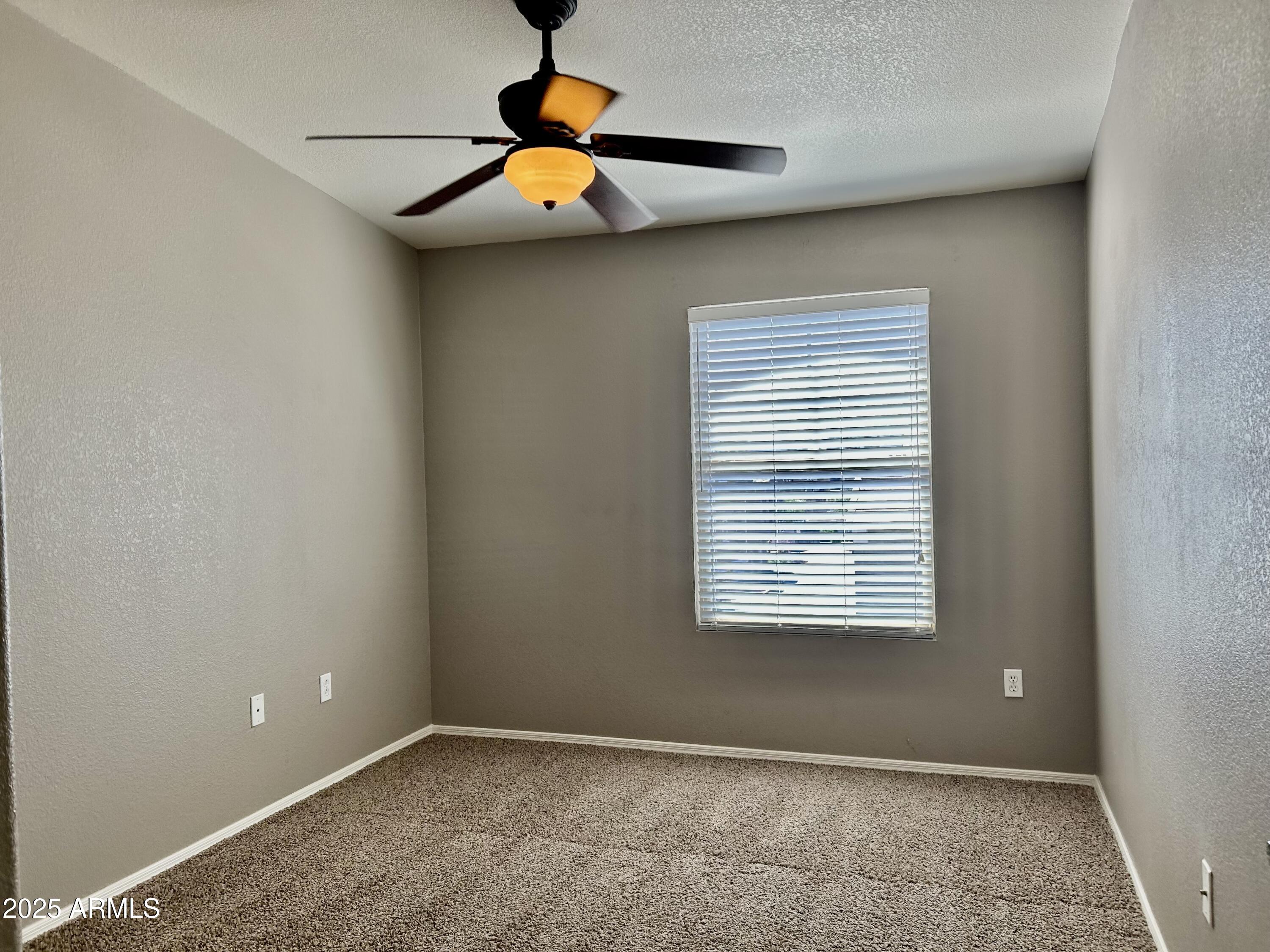 2402 East 5th Street, Unit 1555 Tempe, AZ 85288 - Photo 5 of 12 a view of an empty room with a window