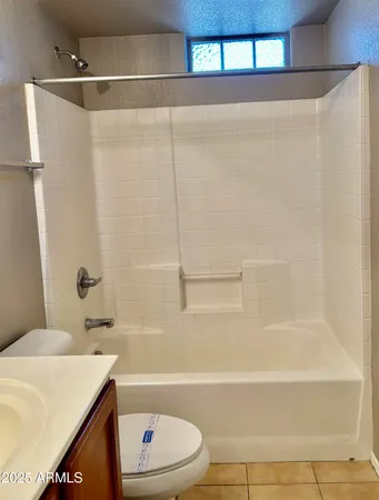 a bathroom with a sink a toilet and a bathtub
