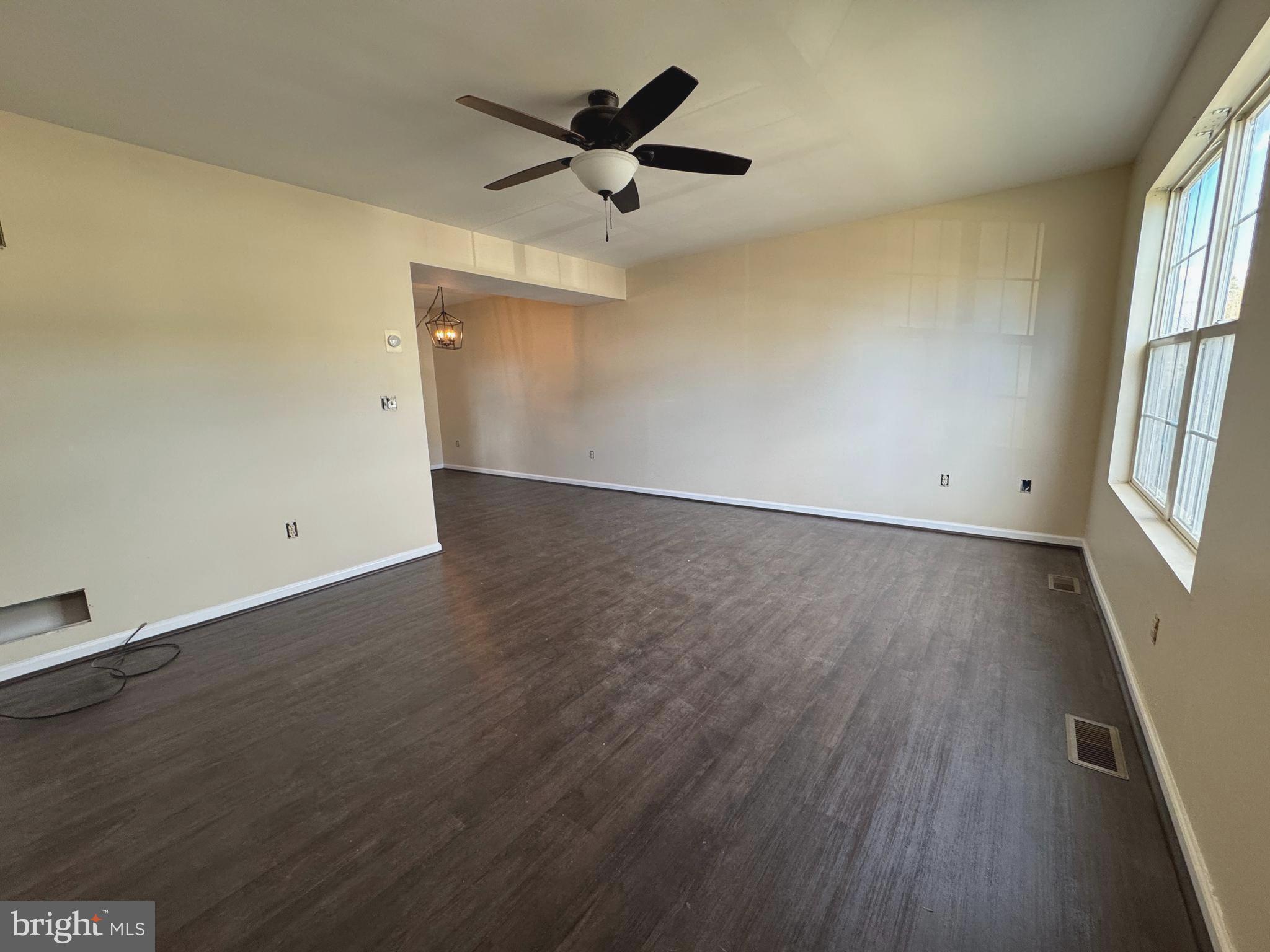 58 North Gala Littlestown, PA 17340 - Photo 3 of 10 wooden floor in an empty room with a window