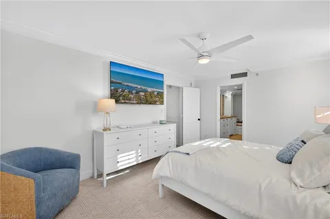 a bathroom with double sink and a mirror