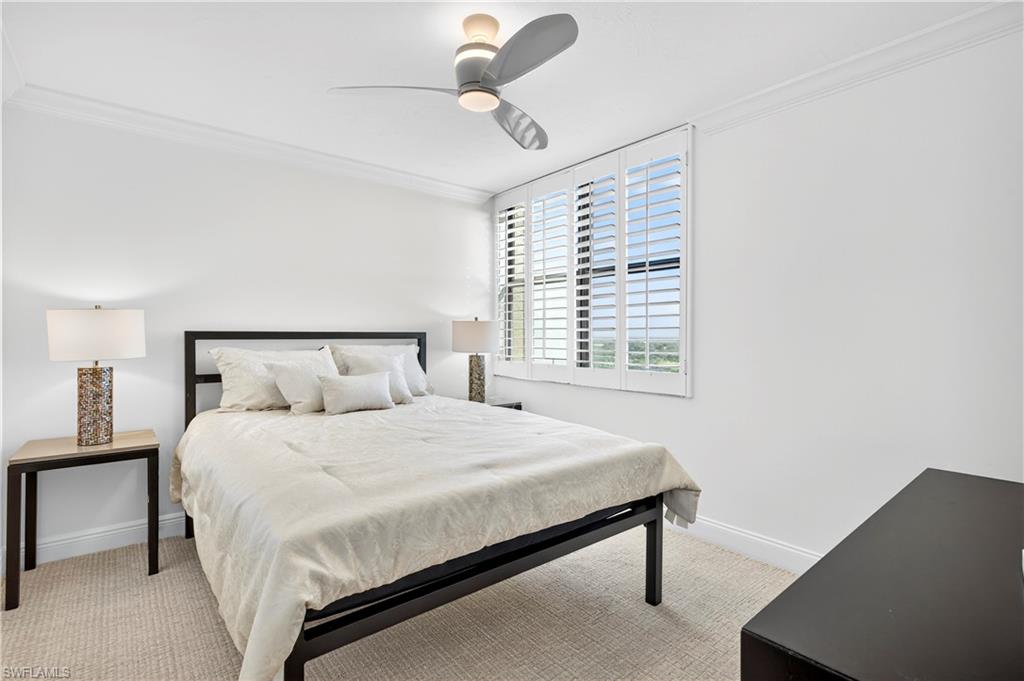 6573 Marissa Loop, Unit 2004 Naples, FL 34108 - Photo 13 of 30 a bedroom with a bed and window