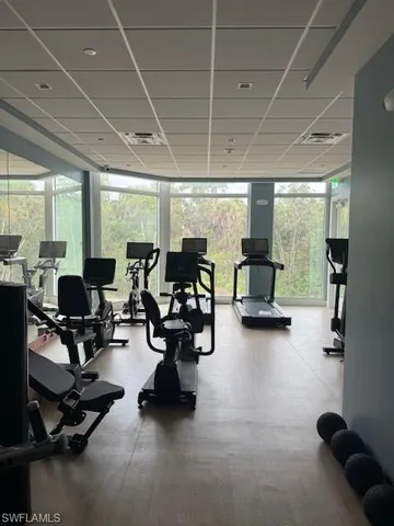 a view of a patio with table and chairs under an umbrella