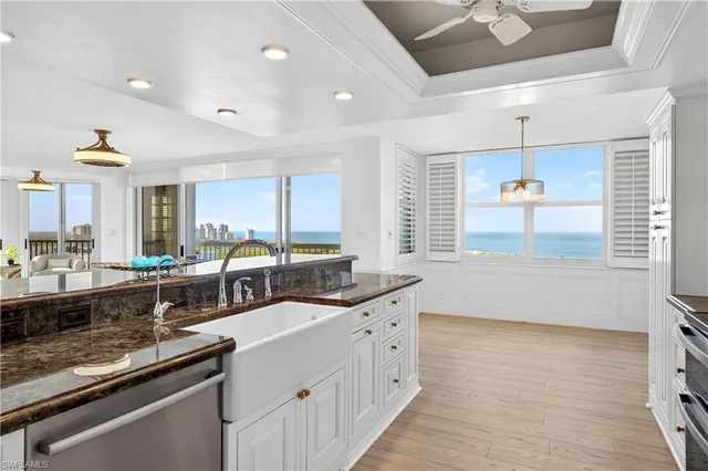 a kitchen with lots of counter space and windows