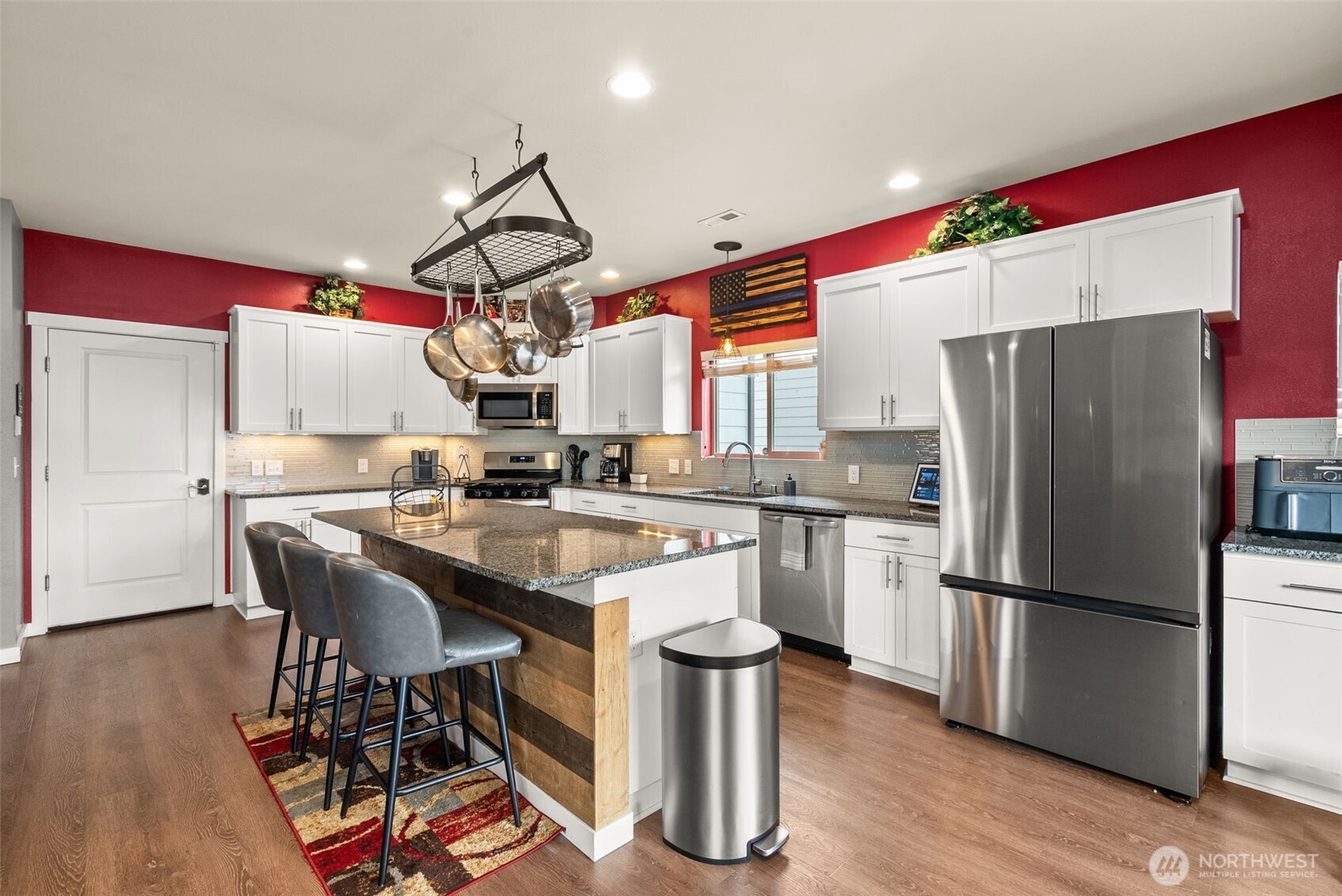 351 South Sergeant Street Buckley, WA 98321 - Photo 12 of 36 a kitchen with a sink a refrigerator and wooden floor