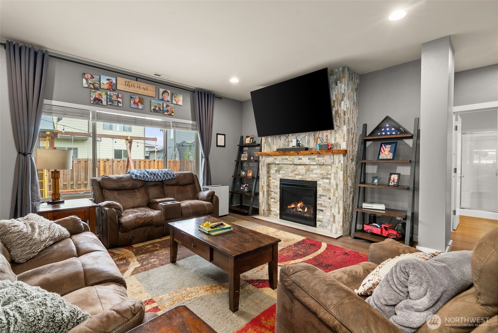 351 South Sergeant Street Buckley, WA 98321 - Photo 13 of 36 a living room with furniture a flat screen tv and a fireplace
