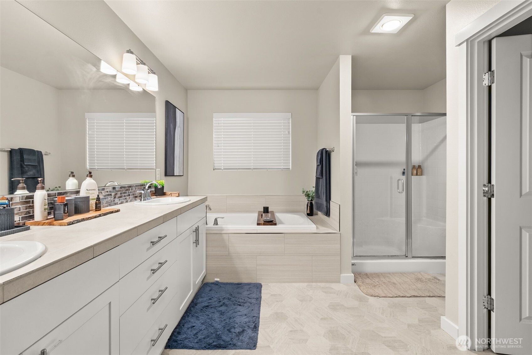 351 South Sergeant Street Buckley, WA 98321 - Photo 21 of 36 a bathroom with a sink double vanity mirror and a bathtub