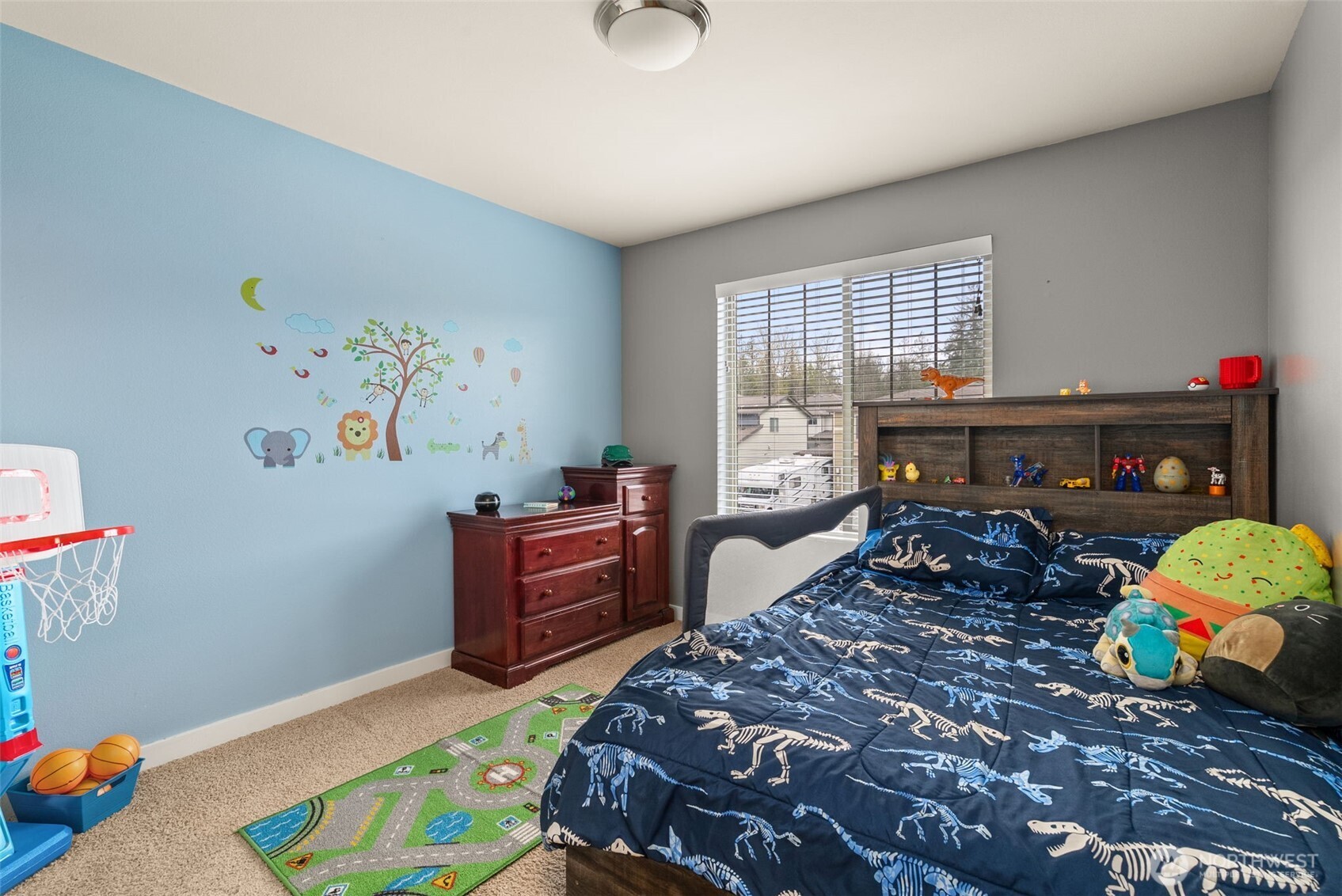 351 South Sergeant Street Buckley, WA 98321 - Photo 26 of 36 a bedroom with a bed and wooden floor