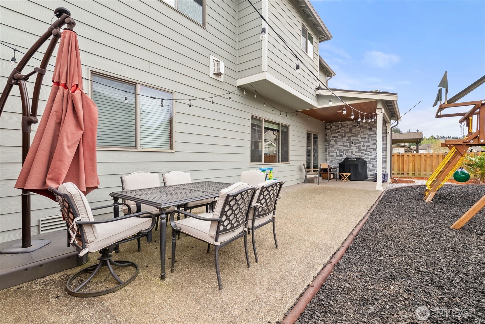 351 South Sergeant Street Buckley, WA 98321 - Photo 31 of 36 a patio with a table and chairs