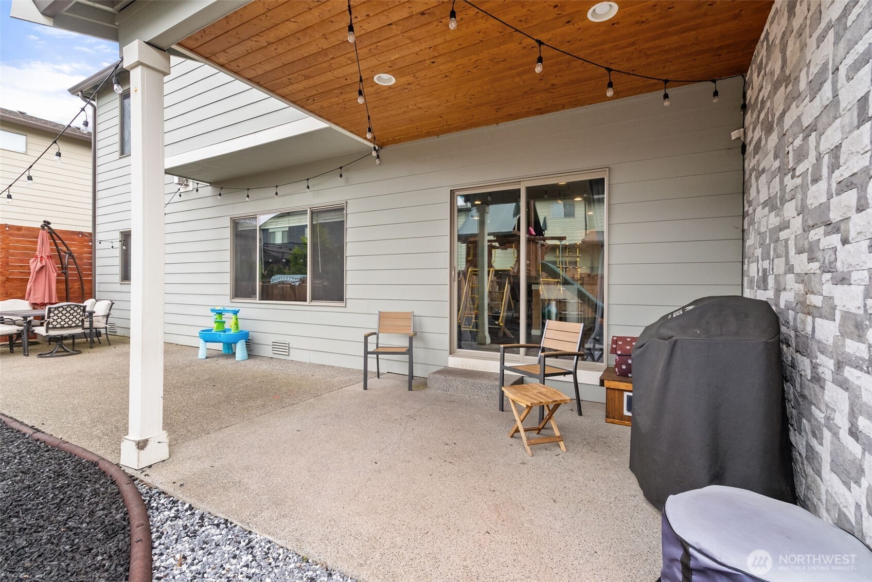 351 South Sergeant Street Buckley, WA 98321 - Photo 33 of 36 a building outdoor space with patio furniture and potted plants