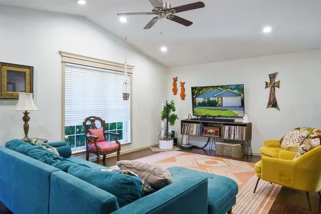 a living room with furniture and a flat screen tv