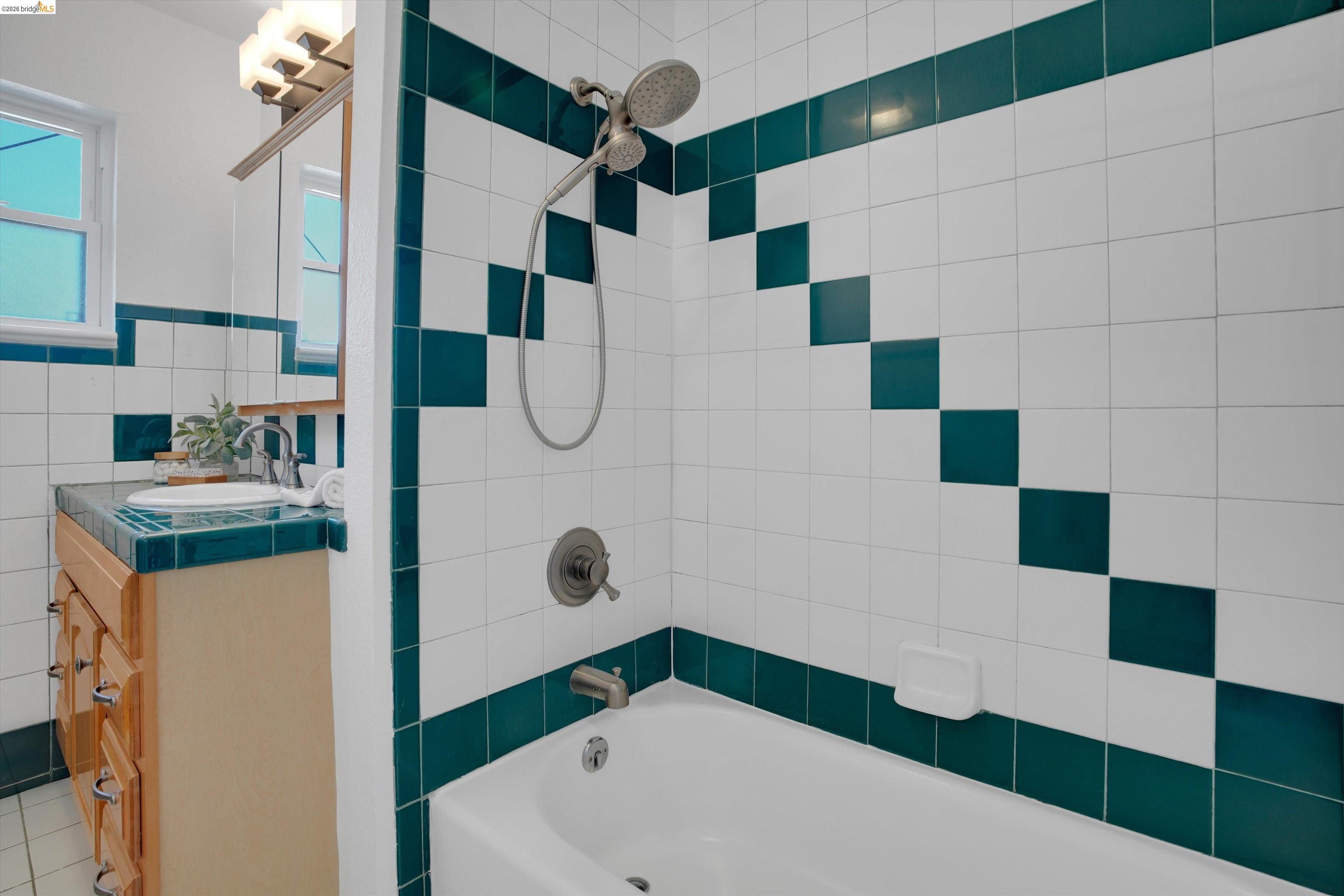 1821 Grand Street Alameda, CA 94501 - Photo 21 of 32 Full bath featuring tile walls, shower / bath combination, and vanity