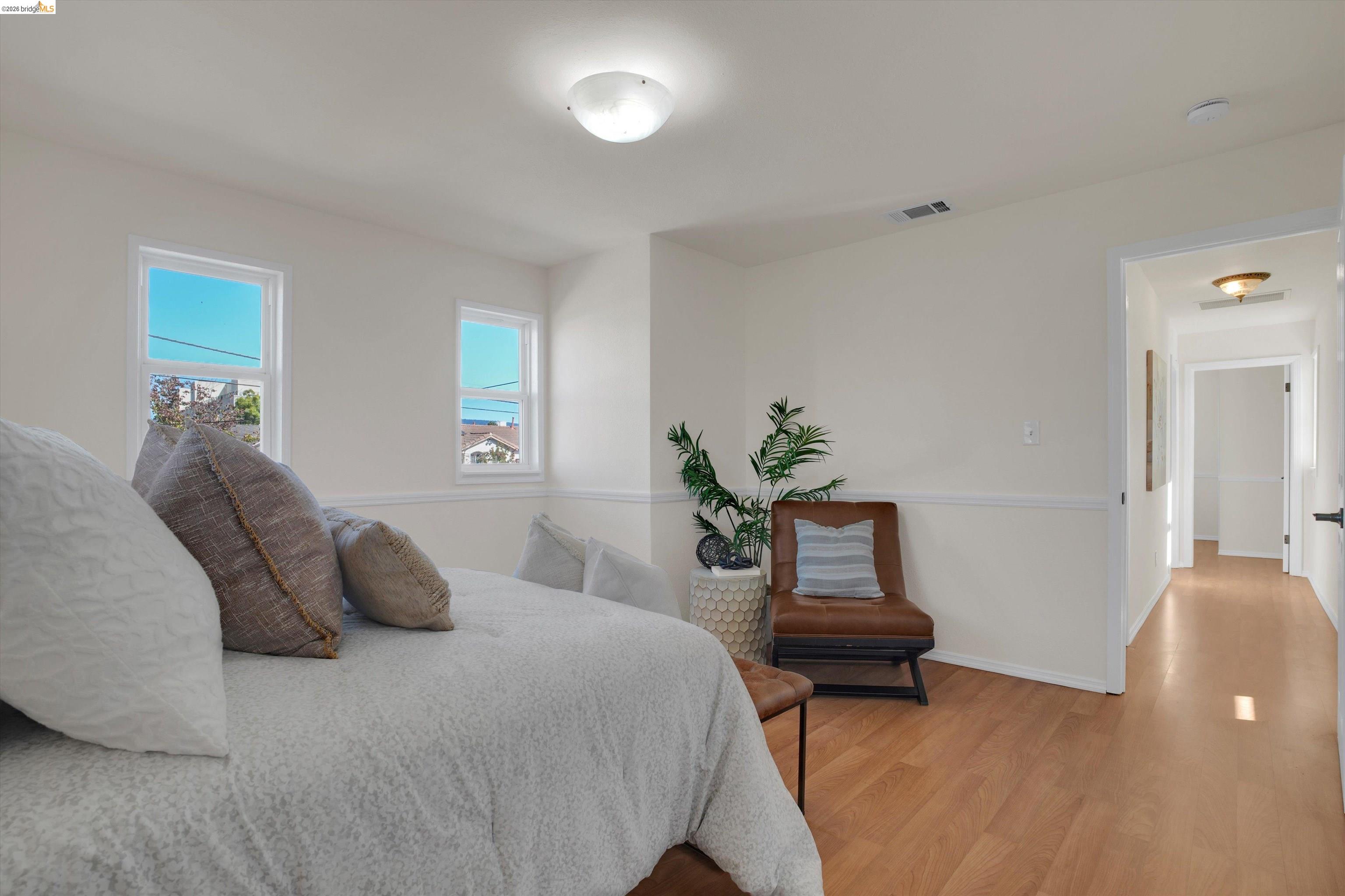 1821 Grand Street Alameda, CA 94501 - Photo 28 of 32 Bedroom with light wood-style flooring and baseboards