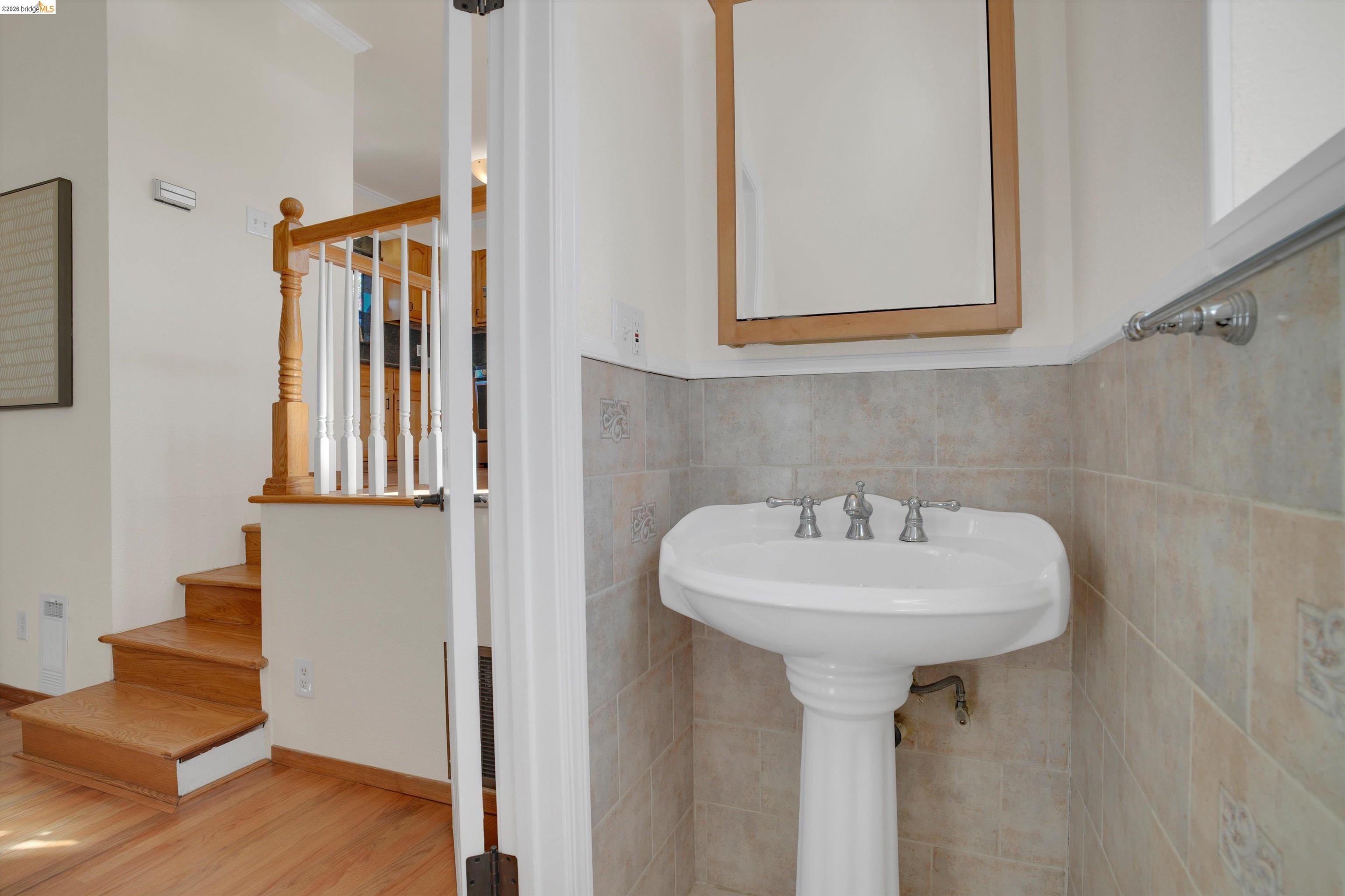 1821 Grand Street Alameda, CA 94501 - Photo 6 of 32 Bathroom featuring wood finished floors and baseboards