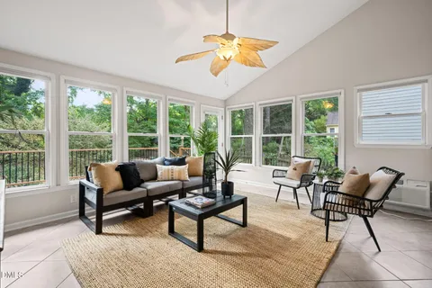 a view of a dining room with furniture and a table