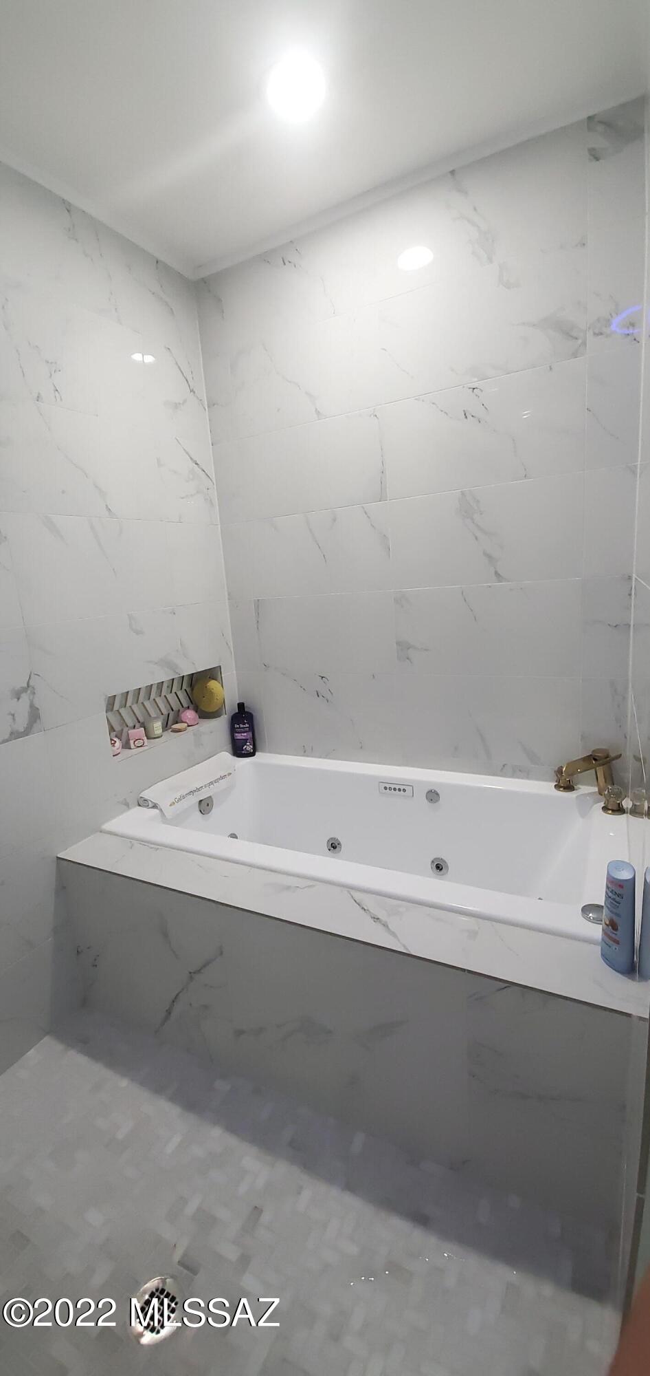 126 Avenida Ostion Rio Rico, AZ 85648 - Photo 12 of 31 a bathroom with a bathtub and a sink
