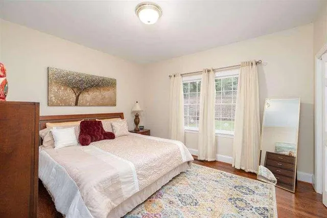 a bedroom with a bed and a closet