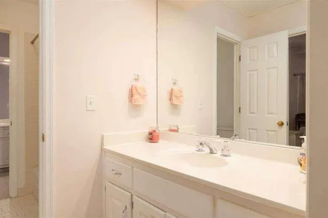 a bedroom with furniture and a chandelier