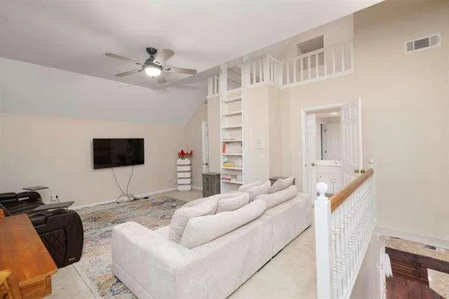 a living room with furniture and a rug