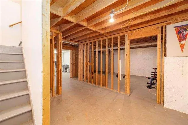 a bedroom with furniture and a chair