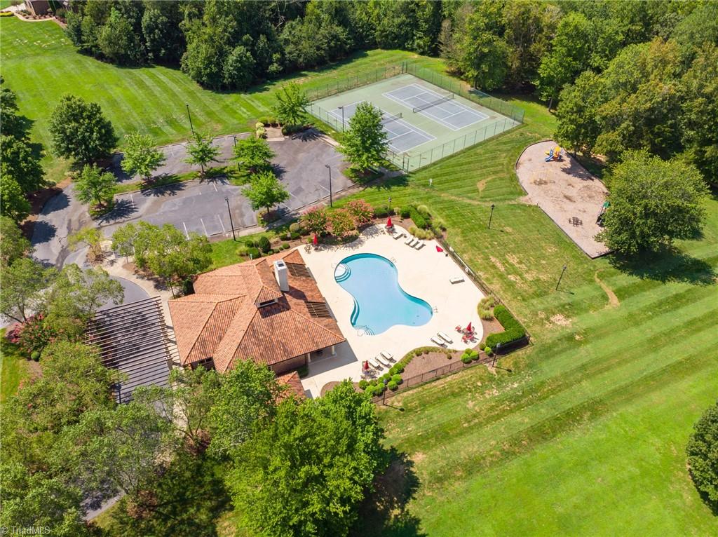 7024 Denison Road Summerfield, NC 27358 - Photo 42 of 43 Neighborhood amenities include clubhouse (available for private events), pool, tennis & pickleball courts, playground, pond, lake & extensive trail system