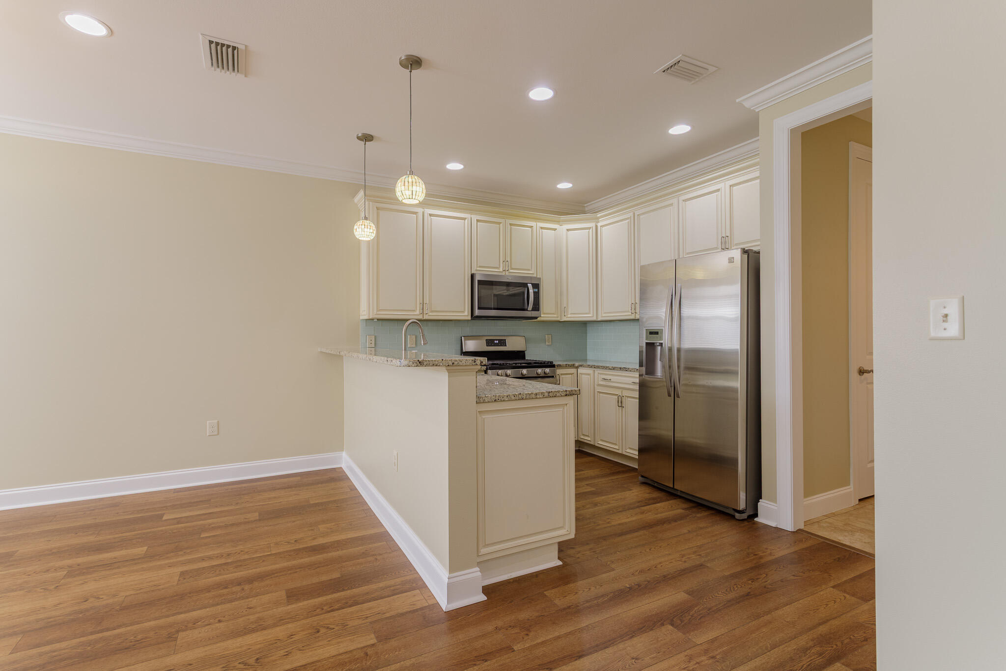 111 Arrowhead Way Niceville, FL 32578 - Photo 11 of 46 a kitchen with a refrigerator a sink and a stove top oven