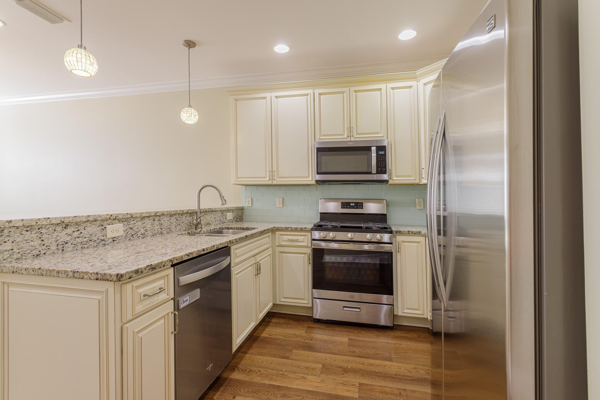 111 Arrowhead Way Niceville, FL 32578 - Photo 12 of 46 a kitchen with stainless steel appliances granite countertop a stove a sink and a refrigerator