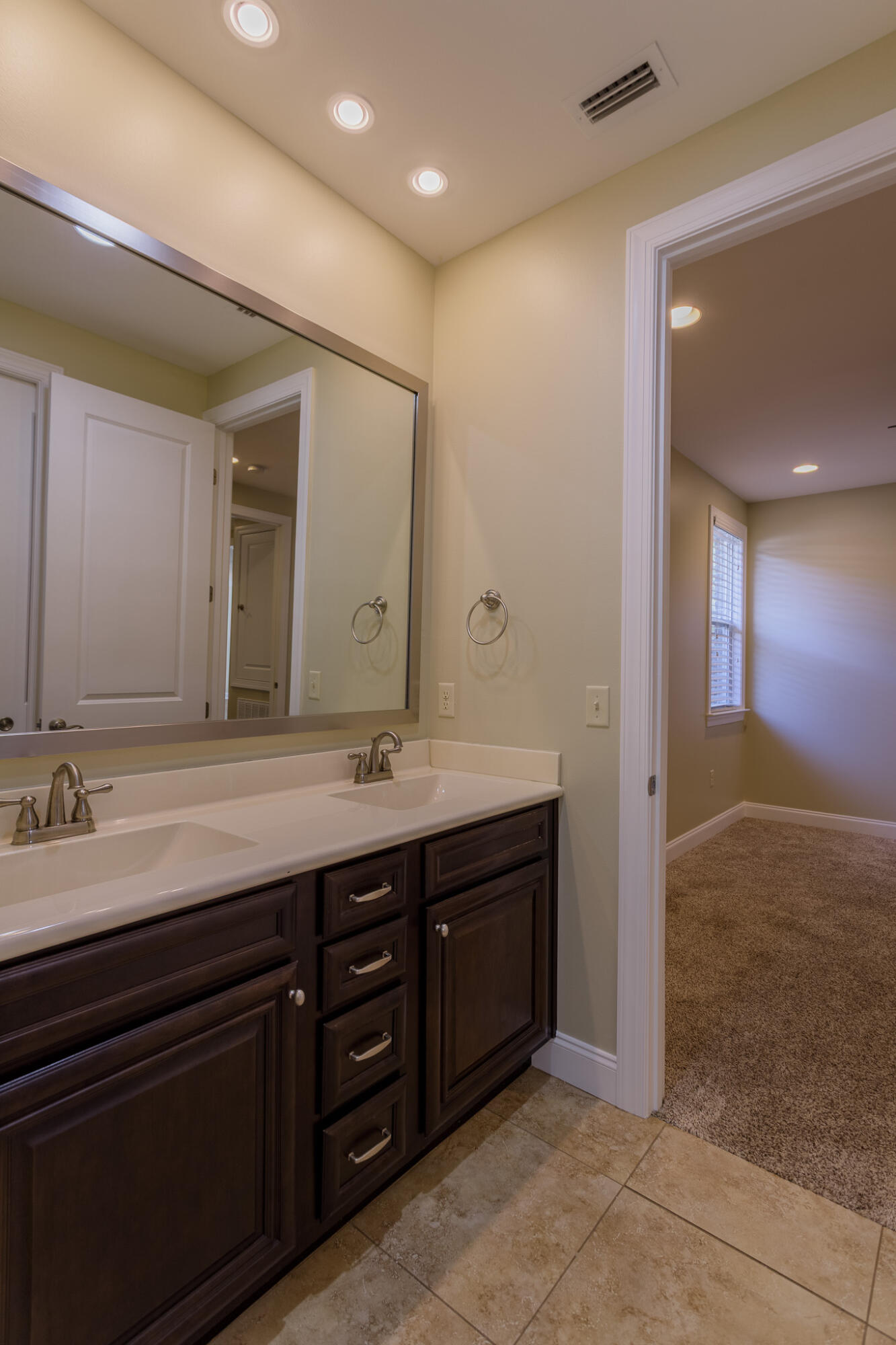 111 Arrowhead Way Niceville, FL 32578 - Photo 21 of 46 a spacious bathroom with a double vanity sink and a mirror