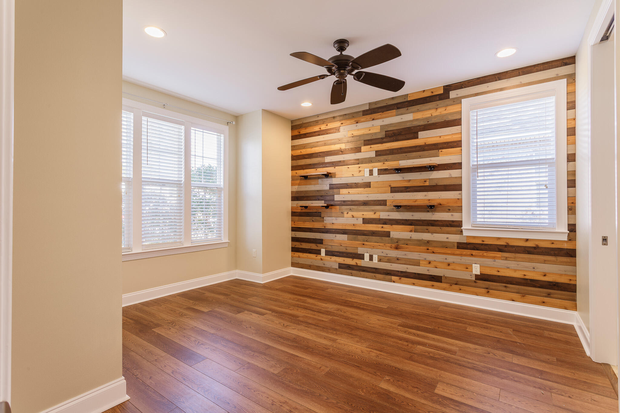 111 Arrowhead Way Niceville, FL 32578 - Photo 28 of 46 a view of room with a ceiling fan and wooden floor