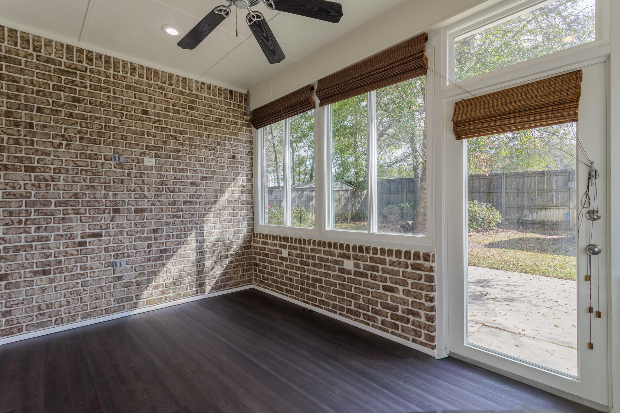 111 Arrowhead Way Niceville, FL 32578 - Photo 32 of 46 a view of an empty room with wooden floor and a window