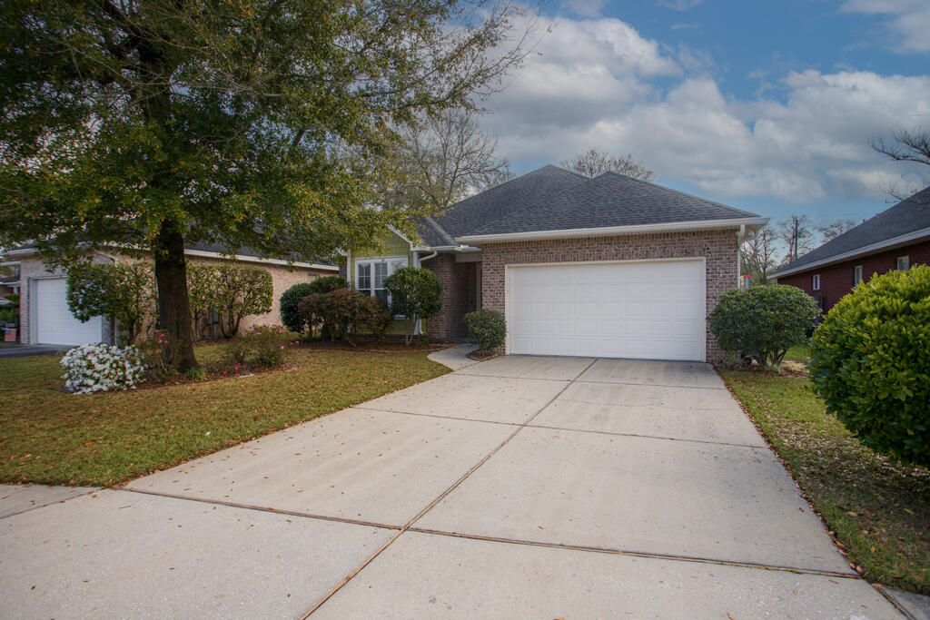 111 Arrowhead Way Niceville, FL 32578 - Photo 33 of 46 a front view of a house with a yard and garage