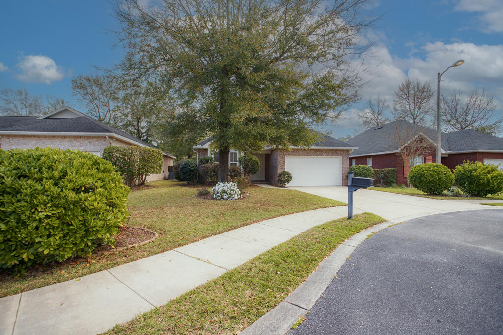 111 Arrowhead Way Niceville, FL 32578 - Photo 38 of 46 a front view of a house with a yard and garage