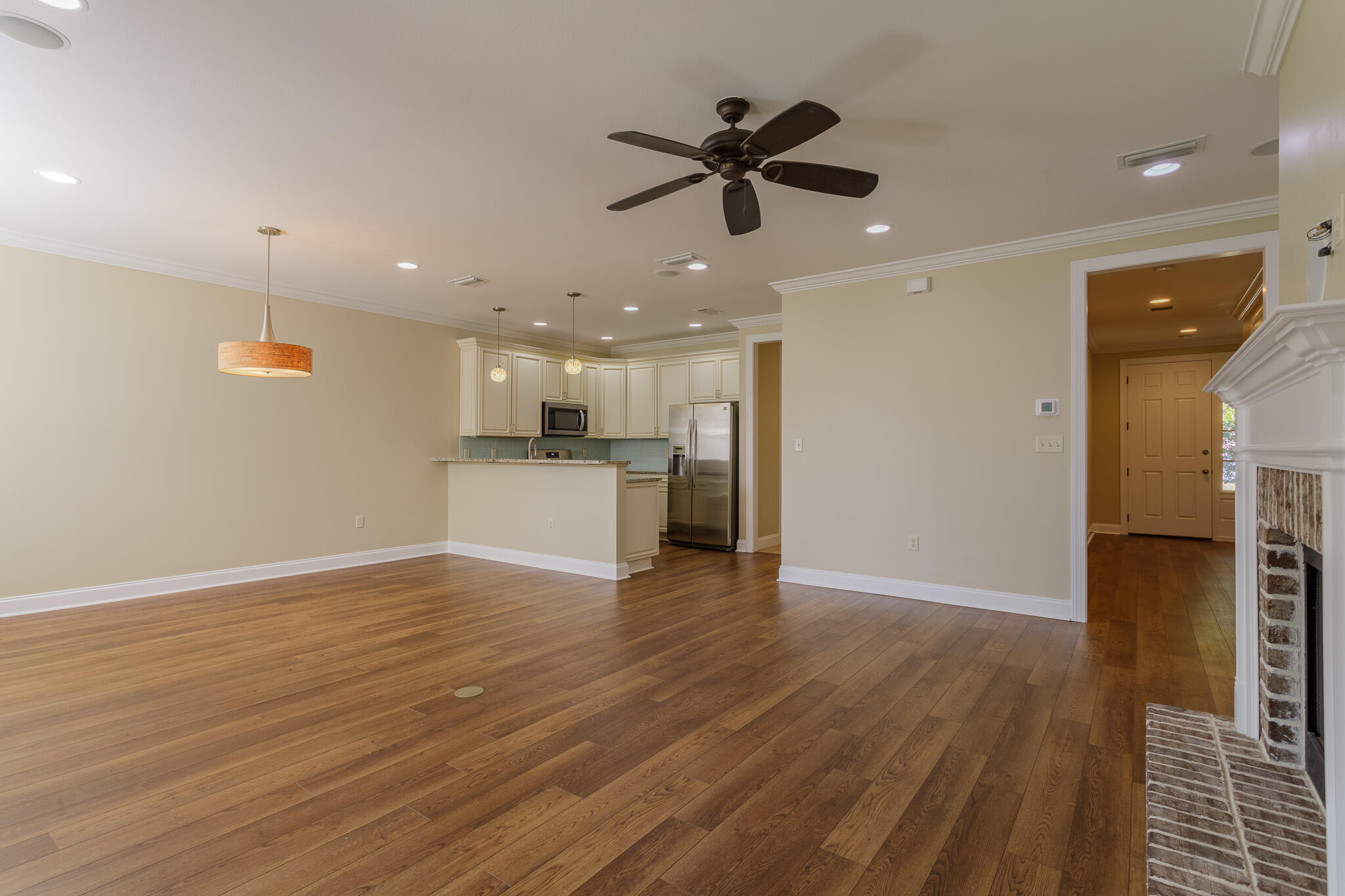 111 Arrowhead Way Niceville, FL 32578 - Photo 5 of 46 a view of a kitchen with a sink and dishwasher a refrigerator with wooden floor