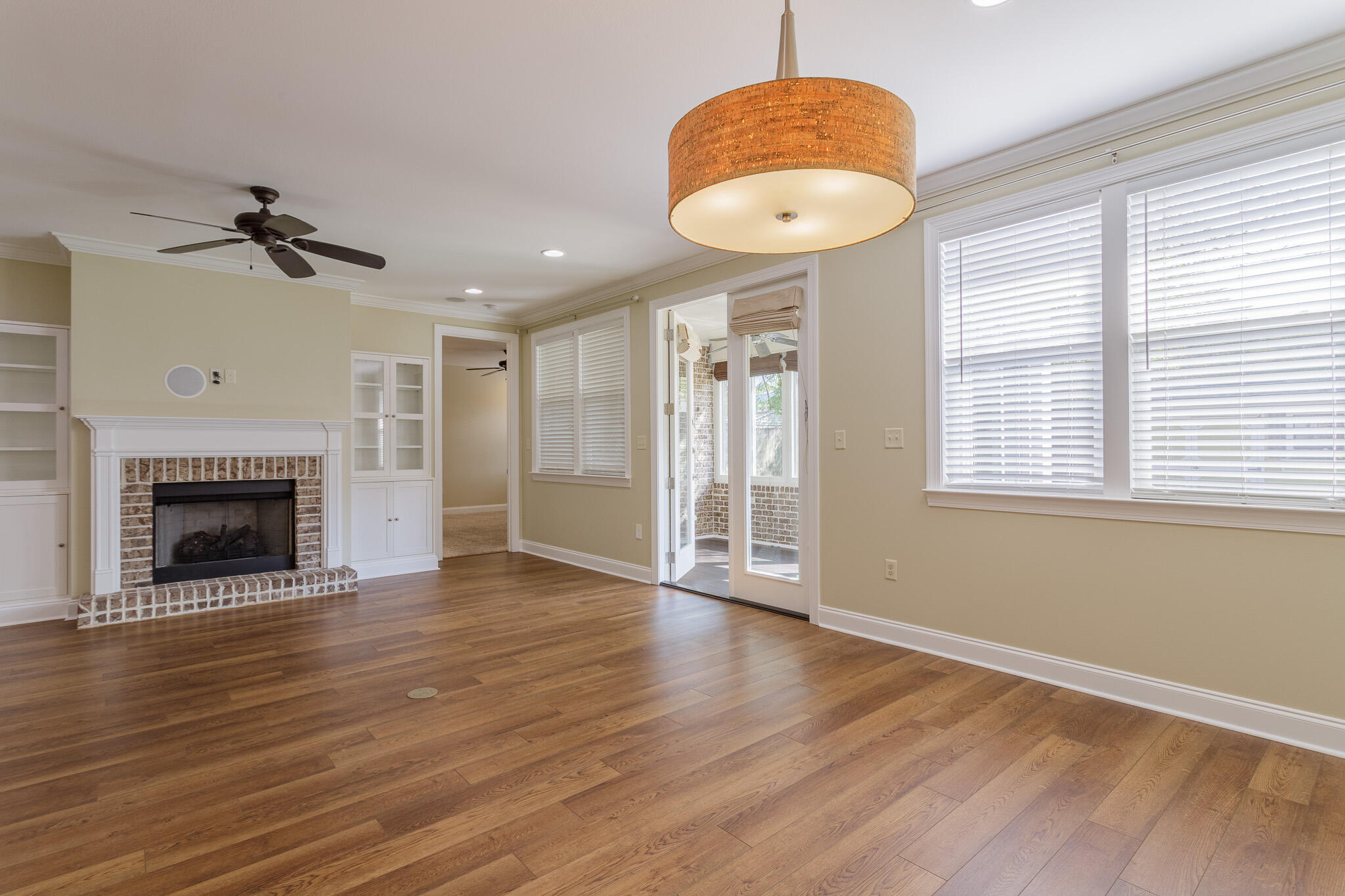111 Arrowhead Way Niceville, FL 32578 - Photo 8 of 46 a view of an empty room with wooden floor and a window