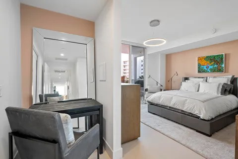 a bedroom with a bed and a couch