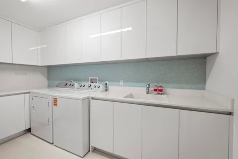 a utility room with cabinets
