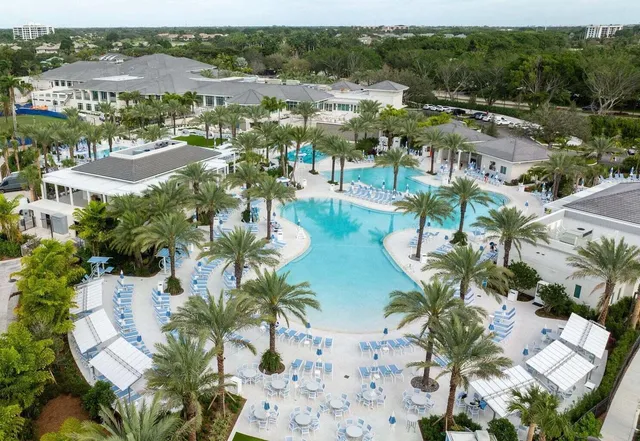 a living room filled with lots of furniture and a table