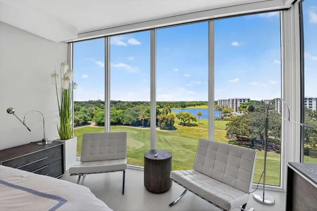 a view of a living room and floor to ceiling window or tub