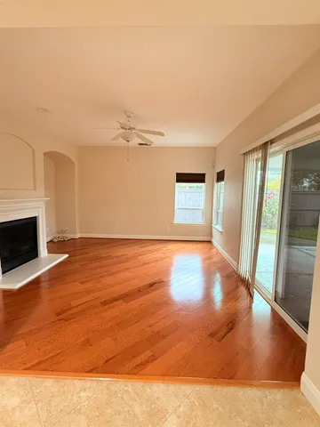 a view of an empty room with glass door