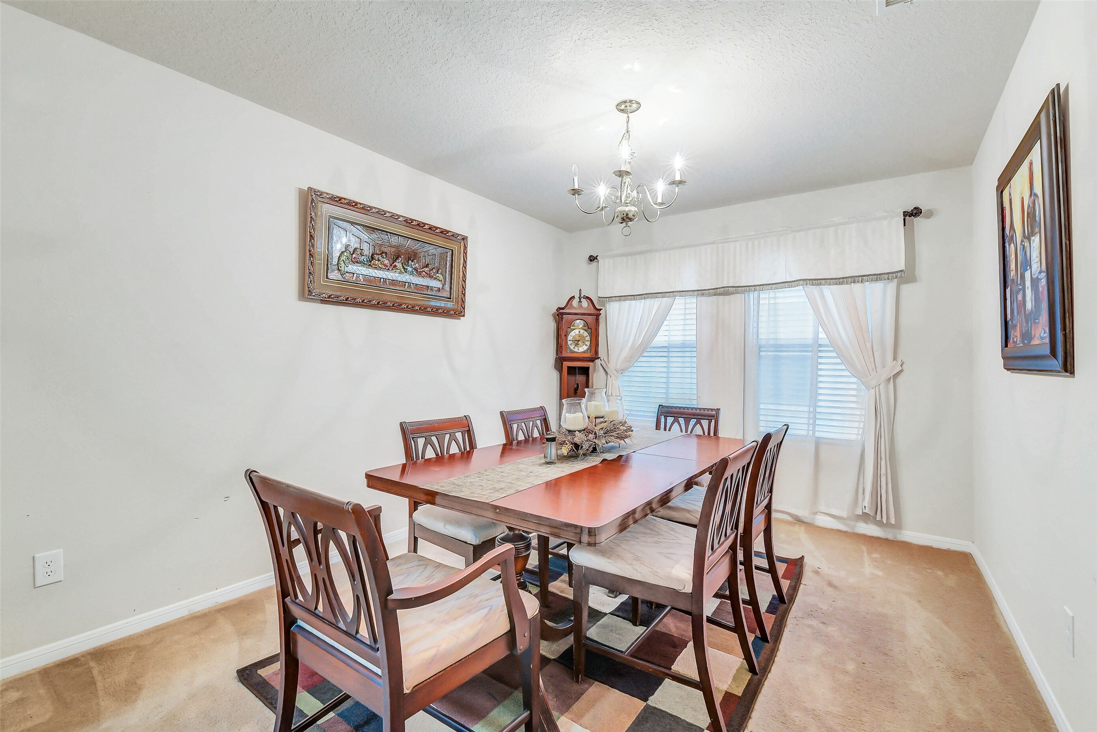 3407 Apple Dale Drive Houston, TX 77084 - Photo 12 of 37 a view of a dining room with furniture and chandelier