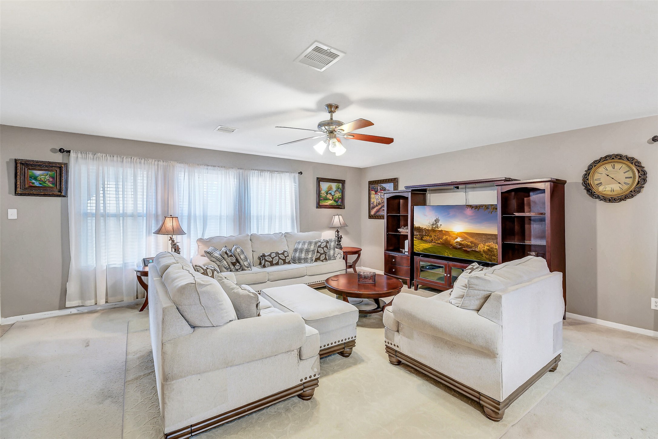 3407 Apple Dale Drive Houston, TX 77084 - Photo 3 of 37 a living room with furniture and a flat screen tv