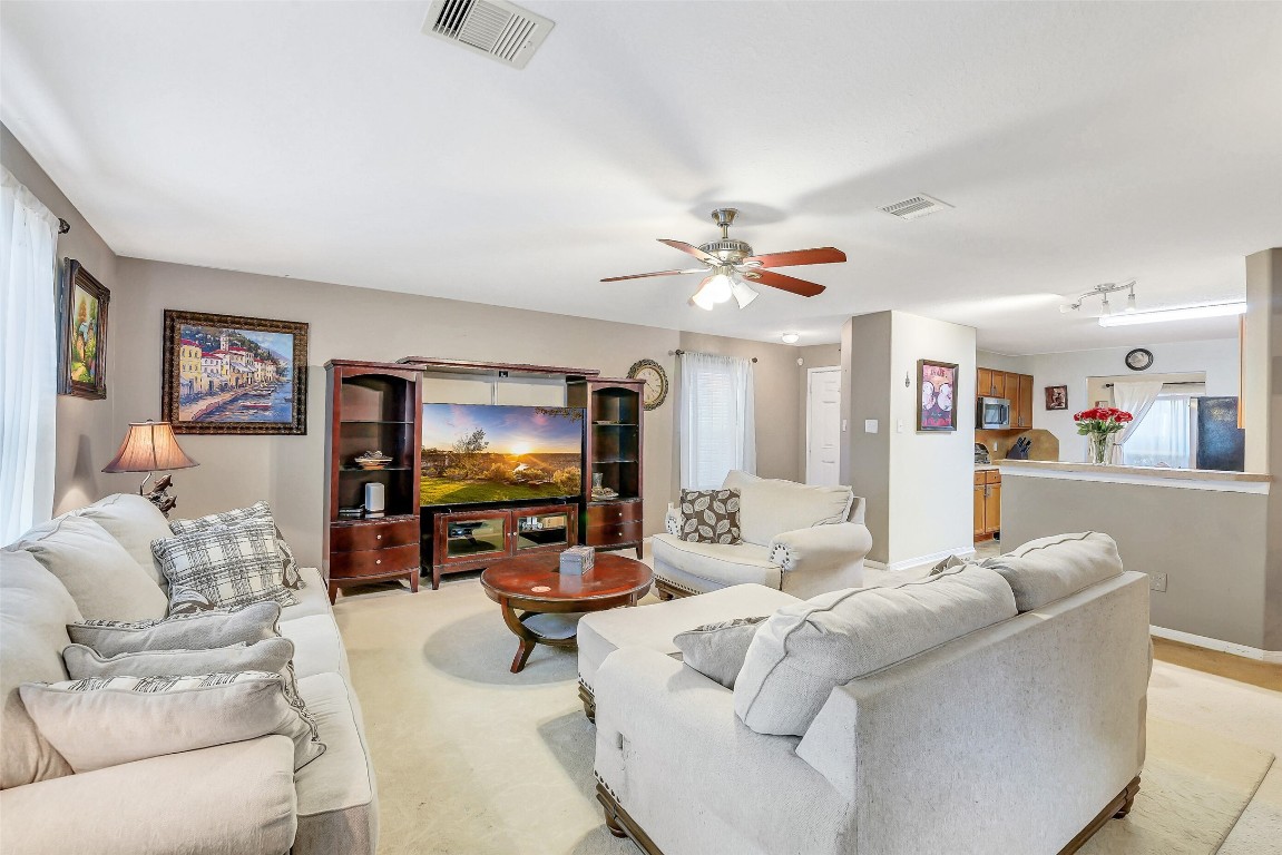 3407 Apple Dale Drive Houston, TX 77084 - Photo 4 of 37 a living room with furniture and a flat screen tv