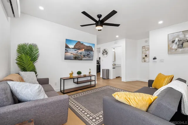 a living room with furniture and a rug