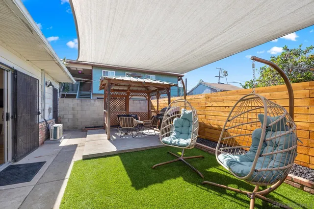 a view of yard with patio