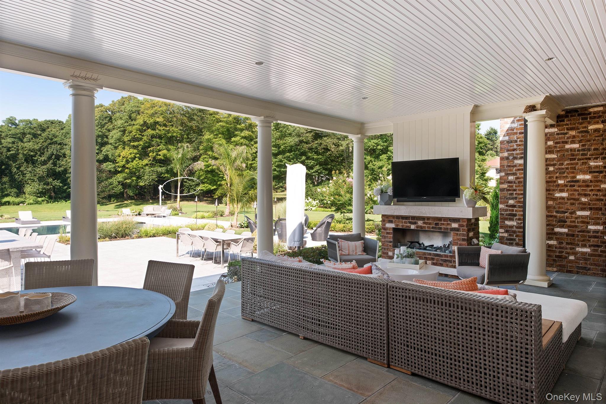 52 Wheatley Road Glen Head, NY 11545 - Photo 39 of 39 Covered patio with fireplace