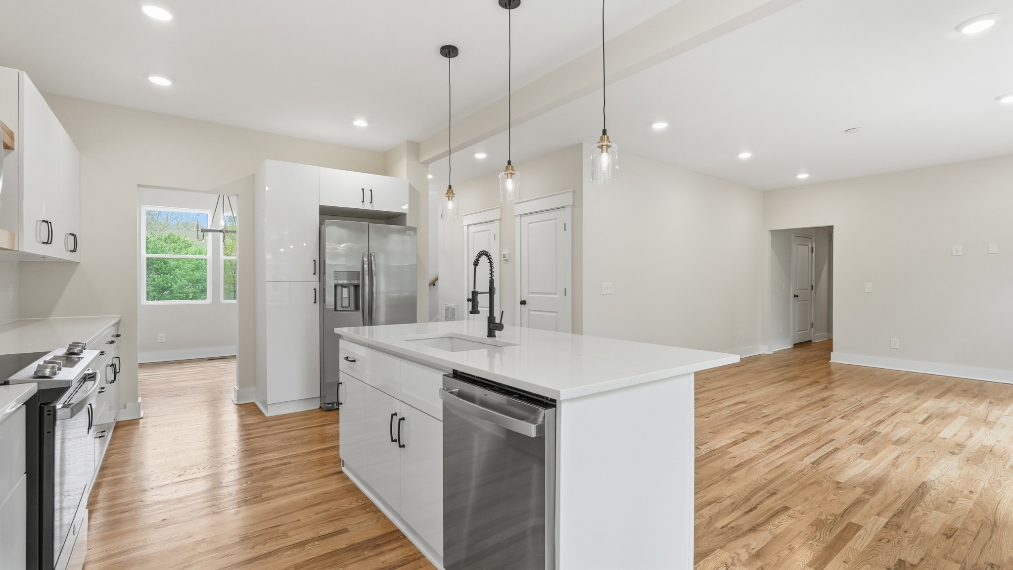 2005 Beaver Ridge Road White Bluff, TN 37187 - Photo 17 of 46 a large kitchen with kitchen island a sink a center island and a wooden floor