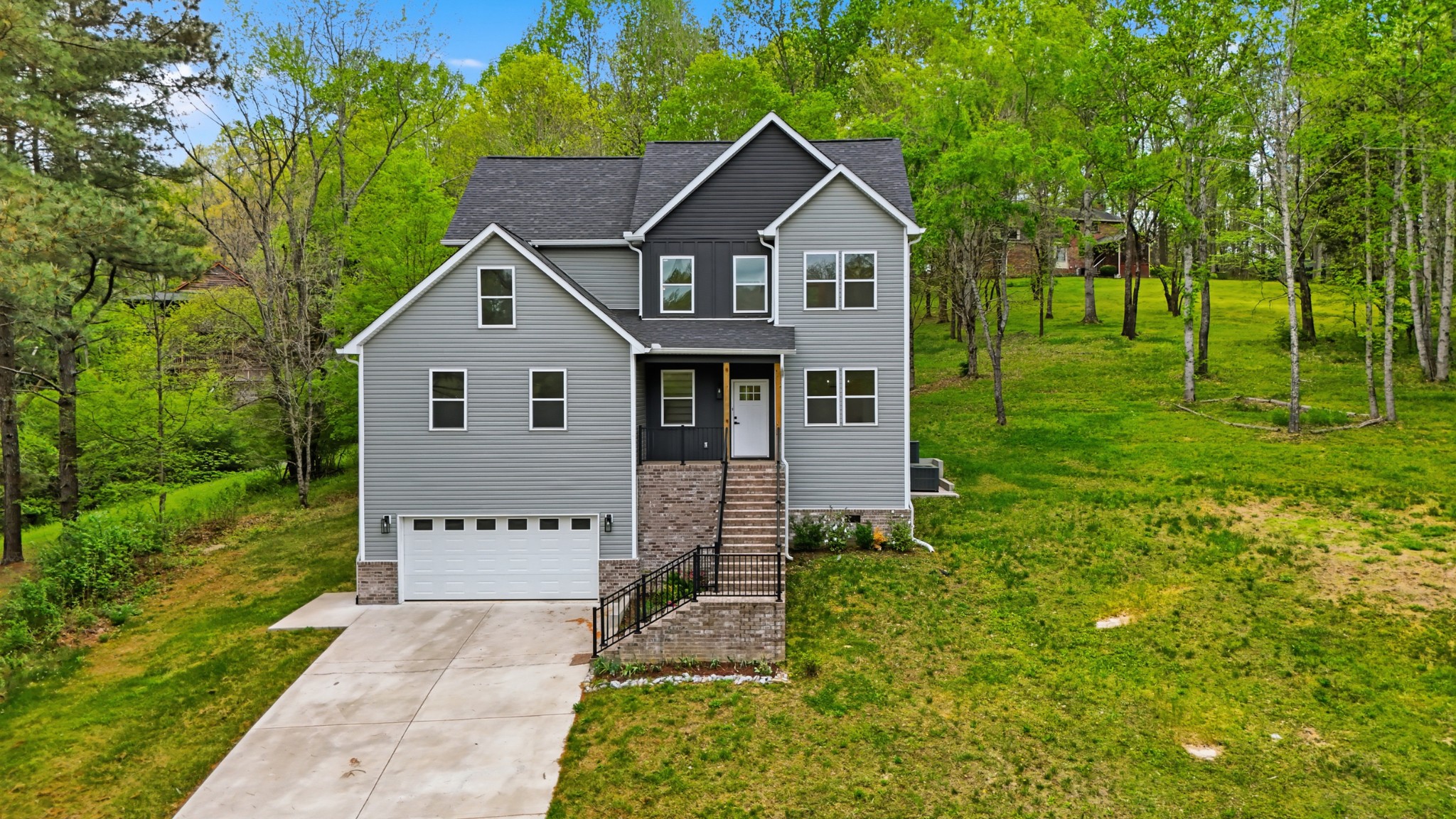 2005 Beaver Ridge Road White Bluff, TN 37187 - Photo 3 of 46 a front view of a house with a yard