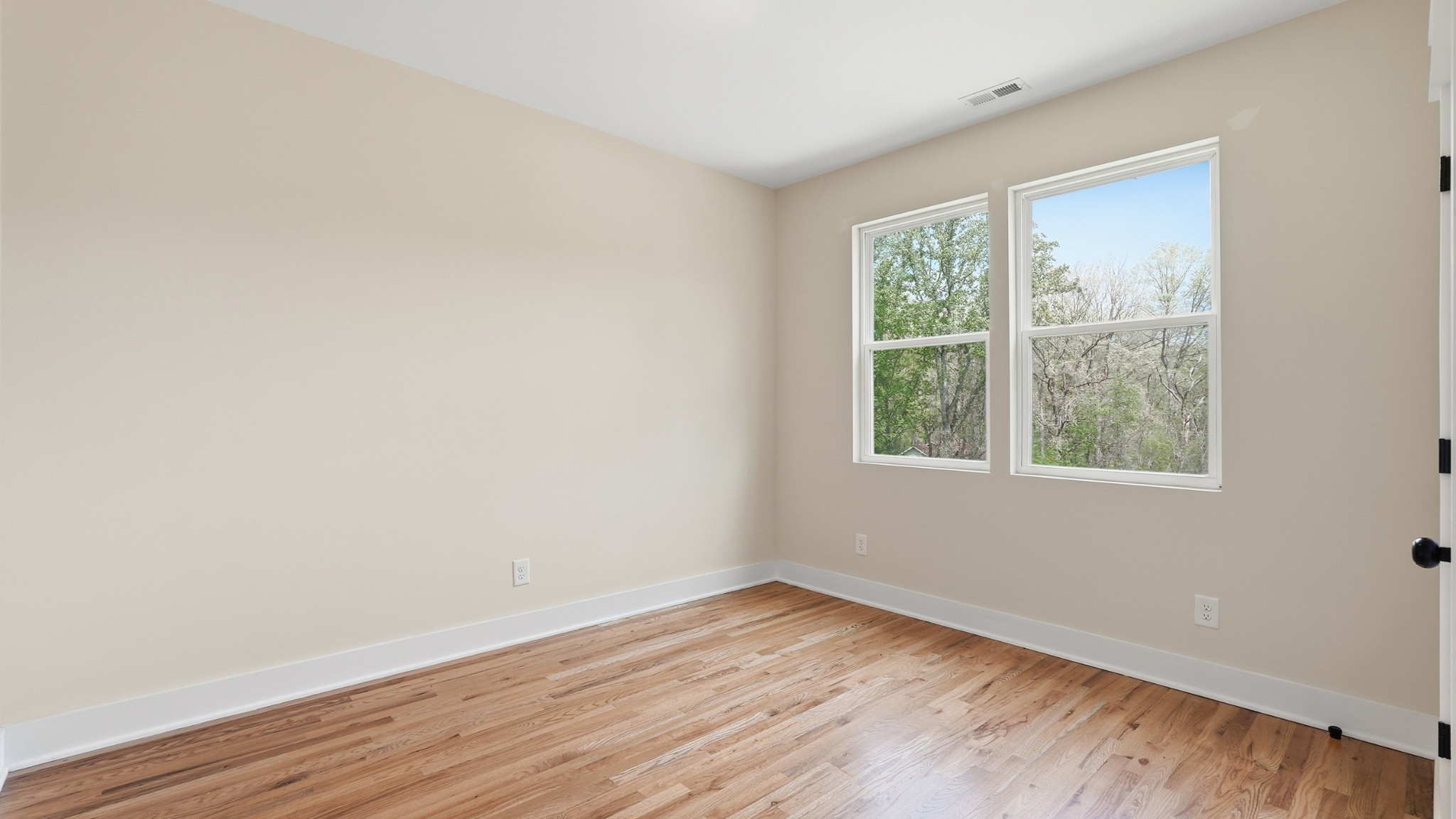 2005 Beaver Ridge Road White Bluff, TN 37187 - Photo 33 of 46 an empty room with wooden floor and windows