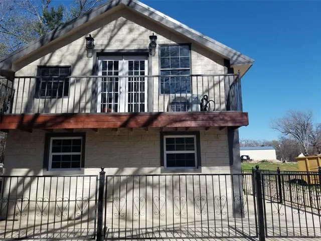 a front view of a house with a porch
