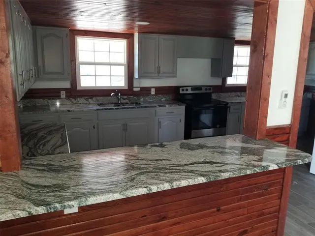 a view of kitchen sink and window
